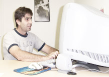 Eric Joseph working at a computer in 1998